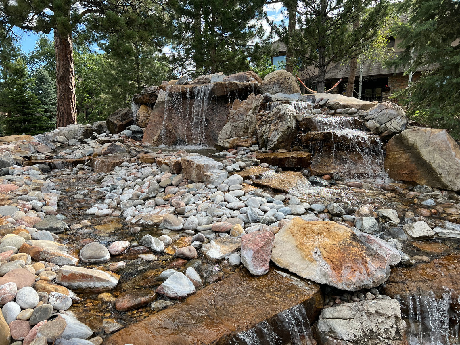 Boulder waterfalls cascading into a rock stream