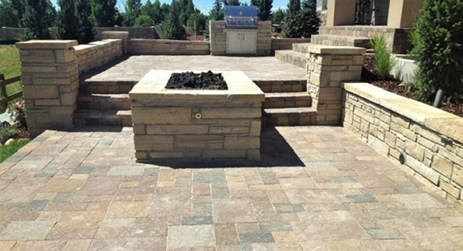 Stone seat walls, columns and a square fire feature